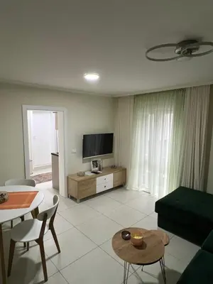 a living room with a television and a table at Paradiso1 in Vračar (historical)