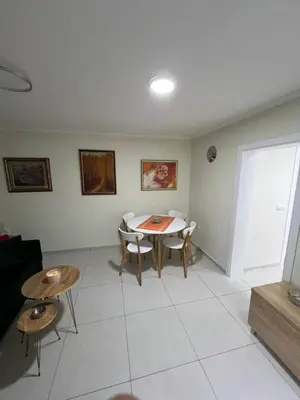 a living room with a table and chairs at Paradiso1 in Vračar (historical)