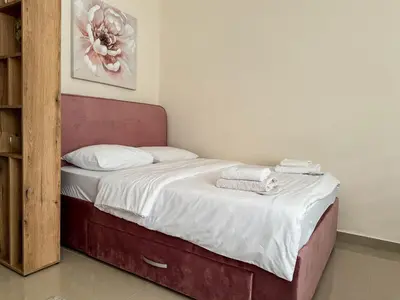 a bed with towels on it in a room at Old Town Central Apartment in Belgrade