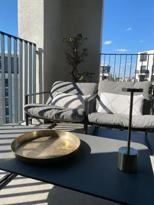 a gold bowl on a table on a balcony at Voyager 360, FREE PRIVATE PARKING in Belgrade
