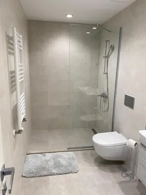 a bathroom with a shower and a toilet at Voyager 360, FREE PRIVATE PARKING in Belgrade