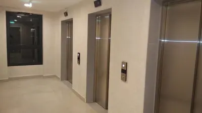 a hallway with three elevators in a building at Voyager 360, FREE PRIVATE PARKING in Belgrade