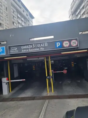 a parking garage with a sign for a parking lot at Mimoza in Novi Beograd