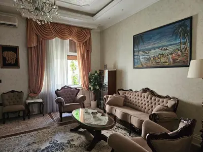 a living room with a couch and a table at Zemun Center LUX 3 bedroom in Belgrade