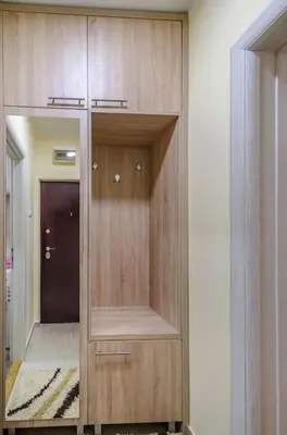 a large wooden cabinet with a mirror in a room at City View 00-24 in Belgrade