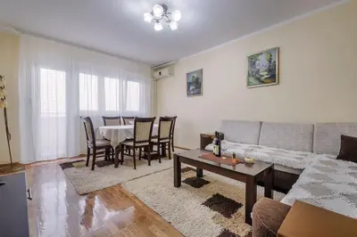 a living room with a couch and a table at City View 00-24 in Belgrade