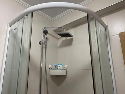 a shower with a shower head in a bathroom at Malina 24 in Belgrade