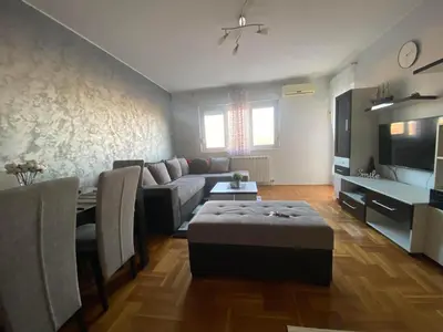 a living room with a couch and a table at Malina 24 in Belgrade