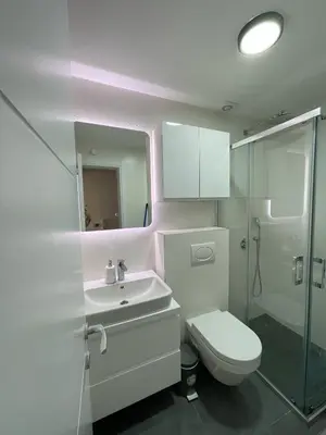 a bathroom with a toilet and a sink and a shower at Magenta Kulina Bana in Belgrade
