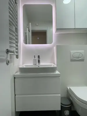 a bathroom with a sink and a mirror at Magenta Kulina Bana in Belgrade