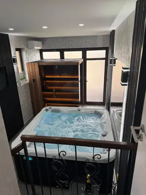 a jacuzzi tub in the middle of a room at Ilic House in Belgrade