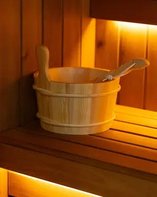 a yellow bucket sitting on top of a wooden shelf at Ilic House in Belgrade
