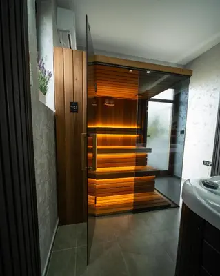 a bathroom with a shower with a glass door at Ilic House in Belgrade