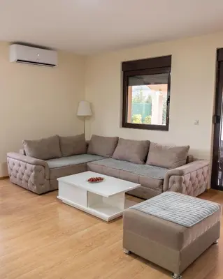 a living room with a couch and a coffee table at Ilic House in Belgrade