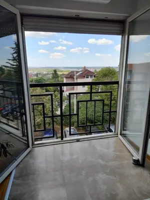 a room with a view of a balcony at Apartman Visnjica in Rospi Ćuprija