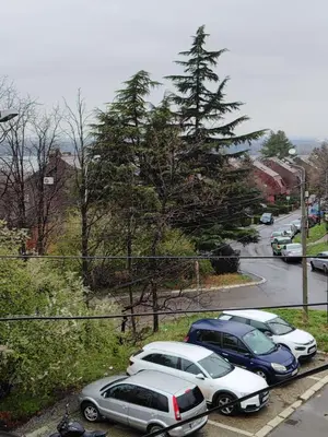 a group of cars parked in a parking lot at Apartman Visnjica in Rospi Ćuprija