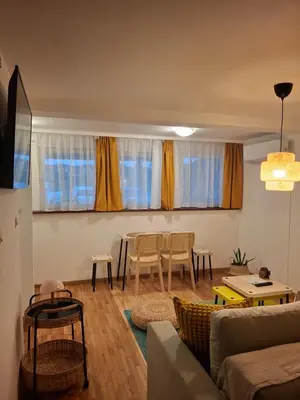 a living room with a couch and a table at Park in Lazarevac