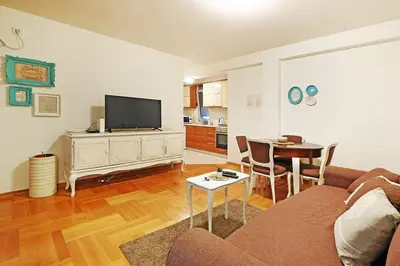 a living room with a couch and a table at Apartment SEIF 2 in Belgrade