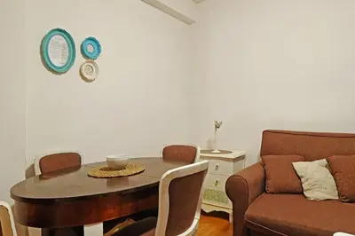 a living room with a table and a couch at Apartment SEIF 2 in Belgrade