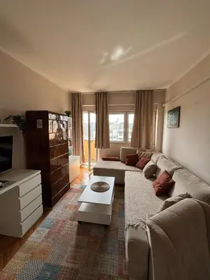 a living room with a couch and a table at Apartment Wellness in Belgrade