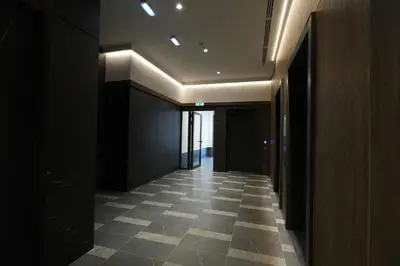 a hallway with a tile floor in a building at Giulia apartment Belgrade Novi Dorcol in Belgrade
