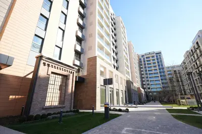 an empty street in a city with tall buildings at Giulia apartment Belgrade Novi Dorcol in Belgrade