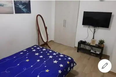 a living room with a bed with stars on it at XENIA2 in Belgrade