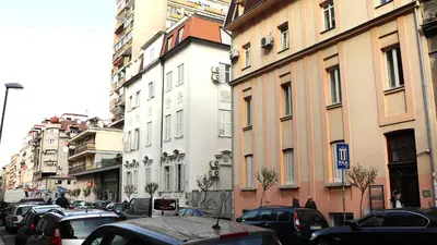 a city street with cars parked on the street at XENIA2 in Belgrade