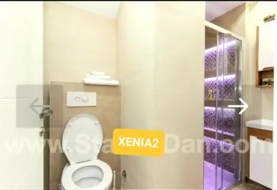 a bathroom with a white toilet in a room at XENIA2 in Belgrade