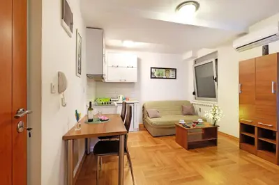 a living room with a couch and a table at Apartment SEIF 1 in Belgrade