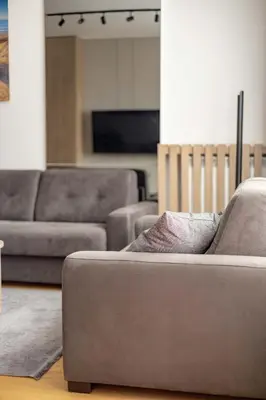 a living room with two couches and a couch at N65 LUX Apartment in Belgrade