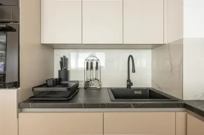 a kitchen with a sink and a counter top at N65 LUX Apartment in Belgrade