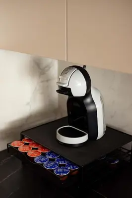 a coffee maker sitting on top of a table at N65 LUX Apartment in Belgrade