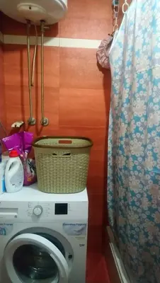 a washing machine with a basket on top of it at Stan Ledine 65m2 in Novi Beograd