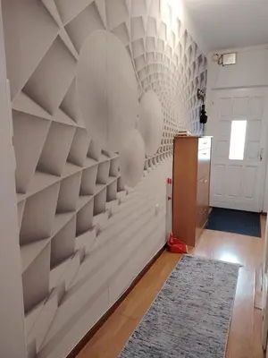 a living room with a wall of shelves at Dorcol-Basic Apartman in Belgrade