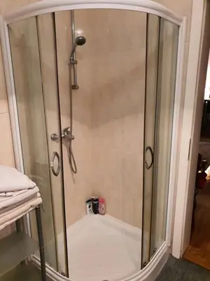 a shower with a glass door in a bathroom at Lavanda in Belgrade