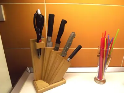 a knife block with knives in it on a counter at TESLA Romantic Cradle-BIG Winter-PROMO Discount in Belgrade