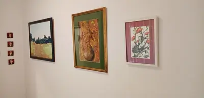 a group of three paintings on a white wall at TESLA Romantic Cradle-BIG Winter-PROMO Discount in Belgrade