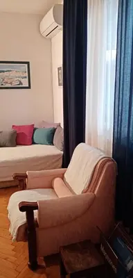 a living room with a couch and a window at TESLA Romantic Cradle-BIG Winter-PROMO Discount in Belgrade