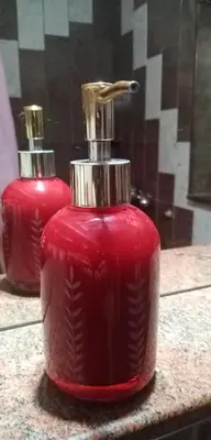 a red bottle sitting on top of a counter at TESLA Romantic Cradle-BIG Winter-PROMO Discount in Belgrade