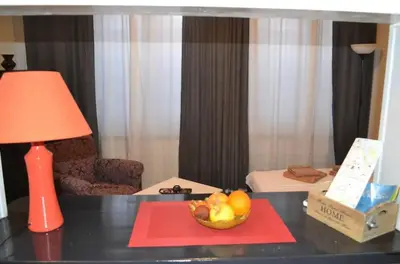 a bowl of fruit on a table with a lamp at BelgradeCity center-Lekic apart 1 in Belgrade