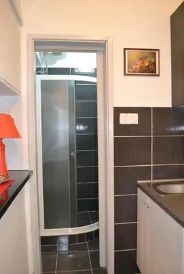 a bathroom with a shower with a glass door at BelgradeCity center-Lekic apart 1 in Belgrade