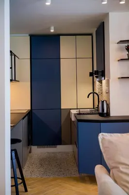 a kitchen with blue cabinets and a sink at Victor Nest Double Room Apartment in Belgrade