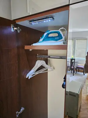 a room with a closet with a door at Modern apartment - quiet street in Belgrade