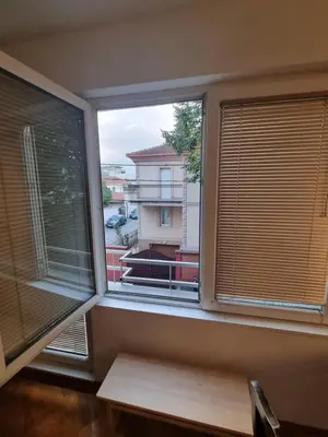 a window with a view of a building at Modern apartment - quiet street in Belgrade