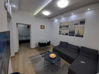 a living room with a couch and a table at XENIA1 in Belgrade