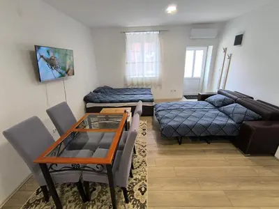 a living room with a couch and a table at Zoka in Surčin