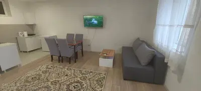 a living room with a couch and a table at Zoka in Surčin