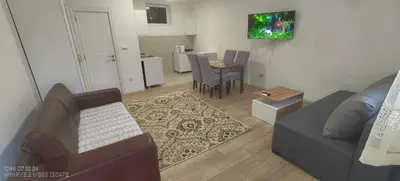 a living room with a couch and a table at Zoka in Surčin