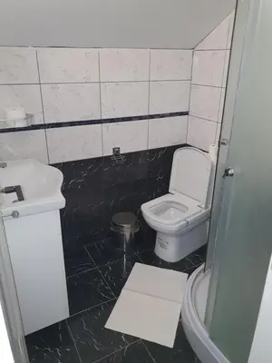 a bathroom with a toilet and a sink at Lux apartment A5 at nice location in Pancevo in Pančevo